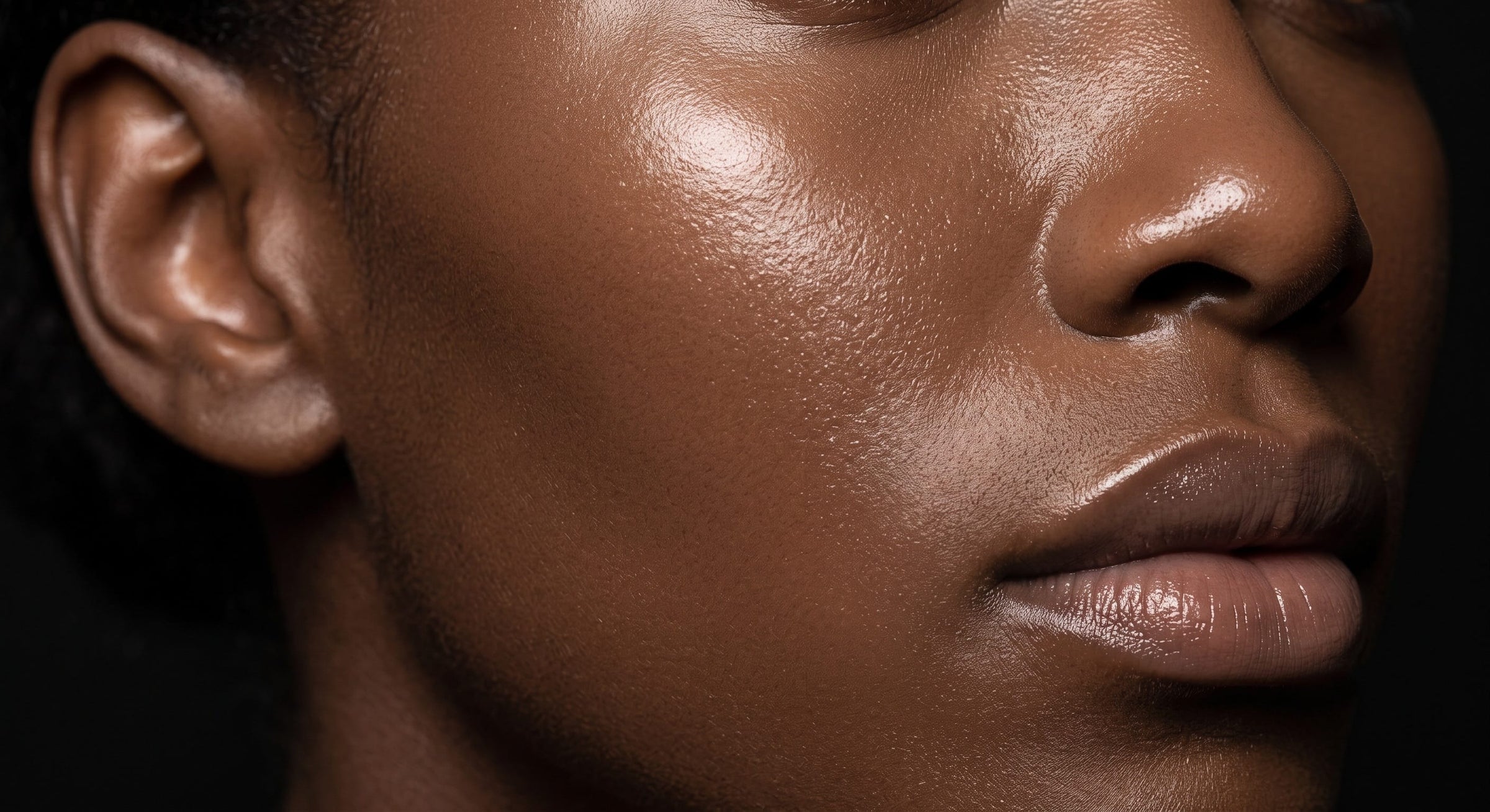 Close-up of clear, even-toned skin on the face and neck after treating a dark neck